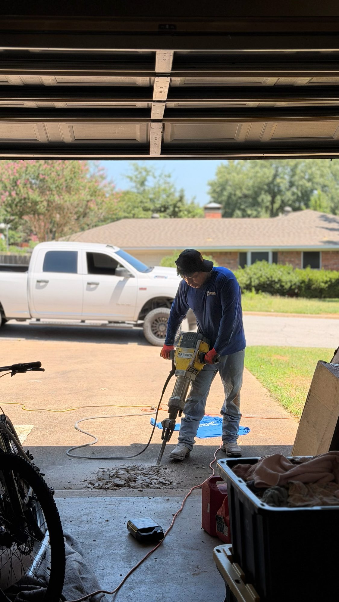 Jackhammer driveway, Imperial Foundation Repair job site in North Texas