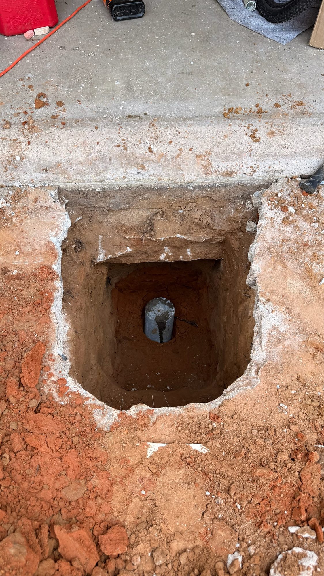 Pier in slab hole, Imperial Foundation Repair job site in North Texas