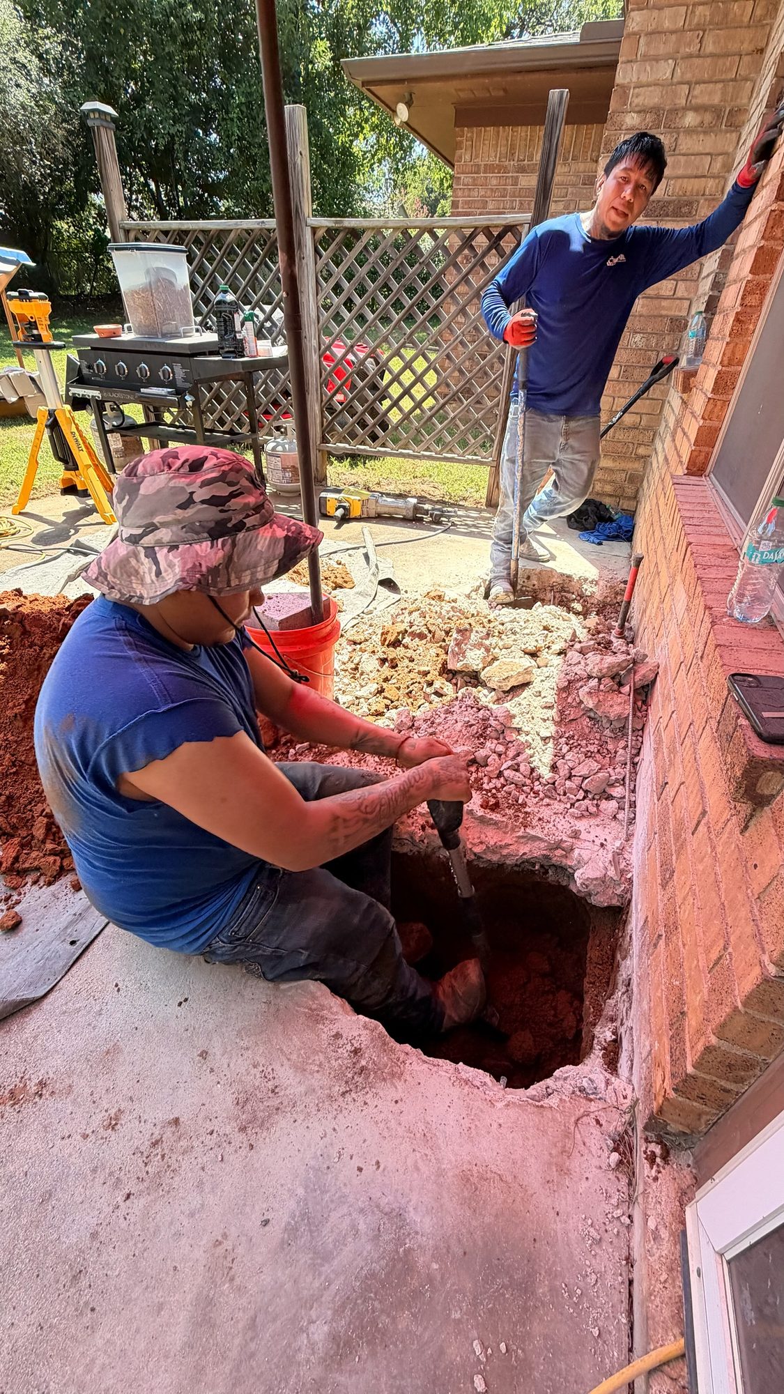 Patio pier hole dig, Imperial Foundation Repair job site in North Texas