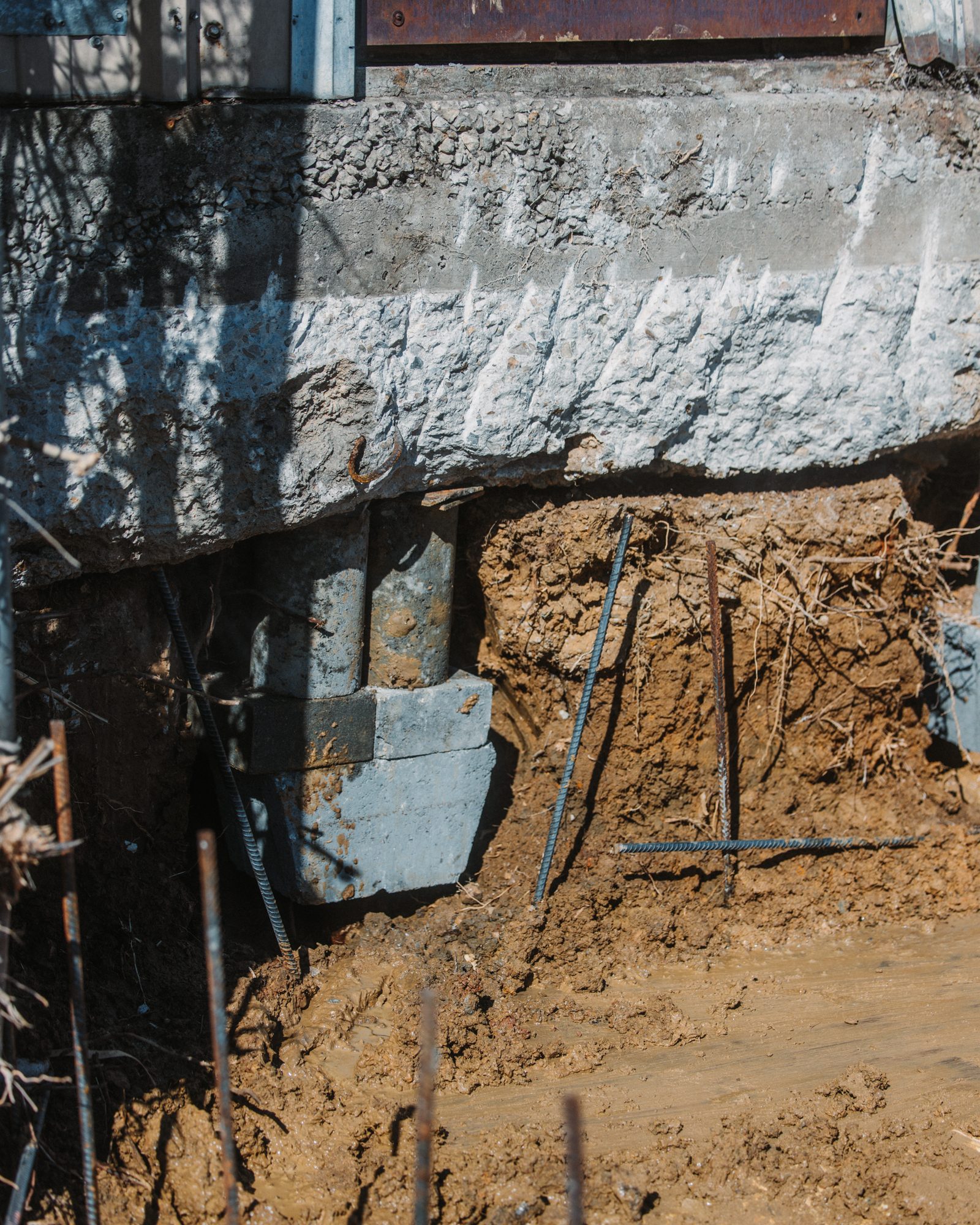 Warehouse pier under gradebeam, Imperial Foundation Repair job site in North Texas