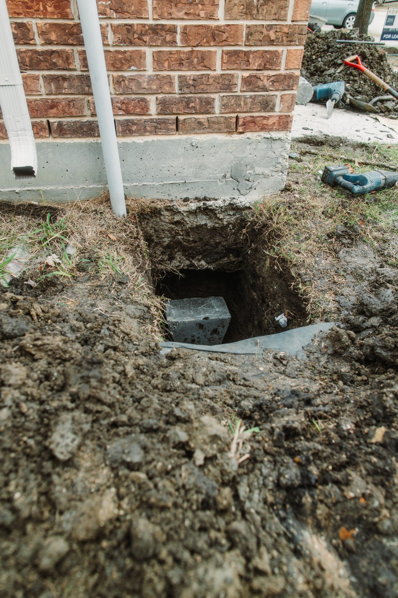Pier block in hole, Imperial Foundation Repair job site in North Texas