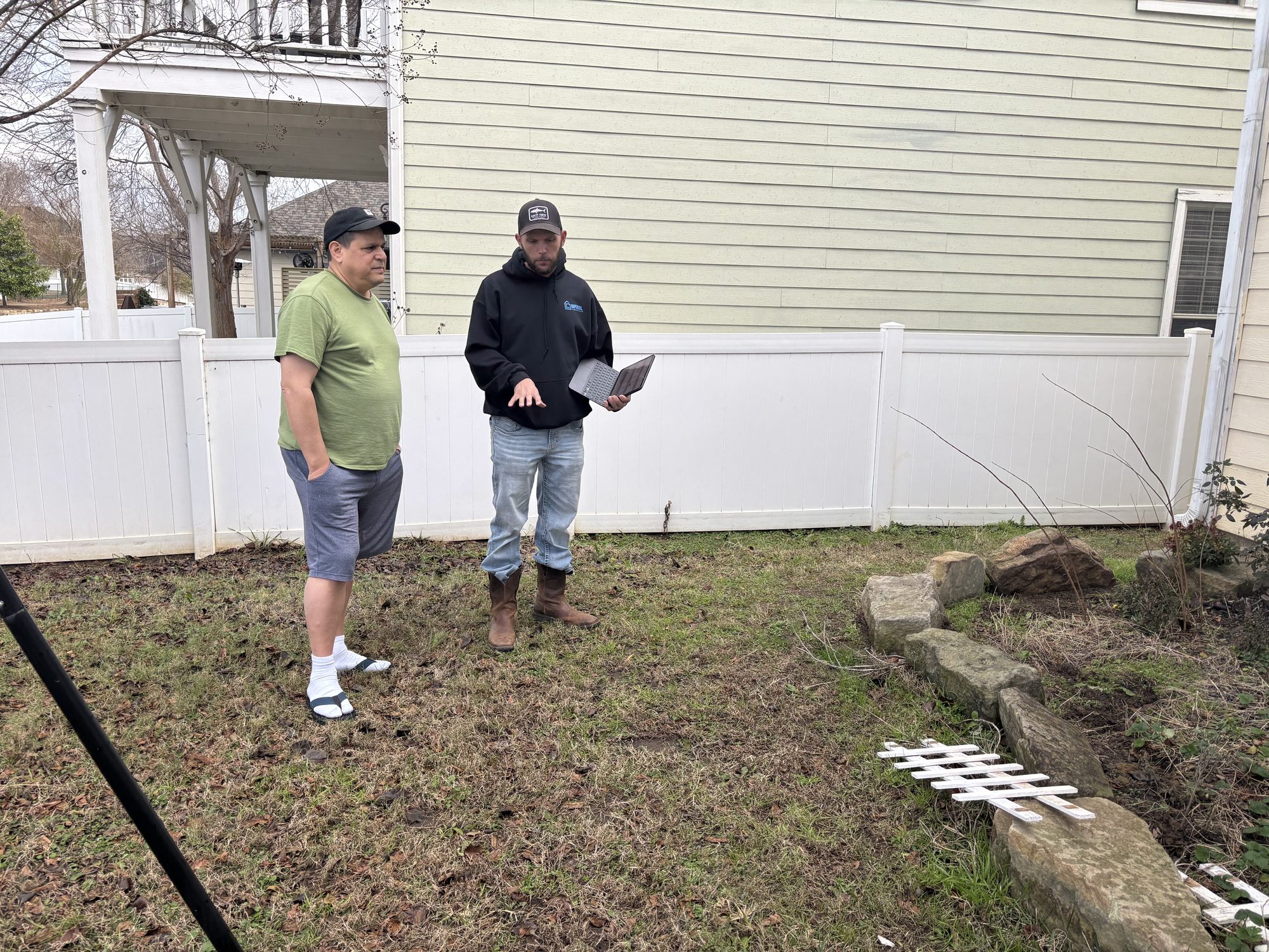Owner explaining to homeowner, Imperial Foundation Repair job site in North Texas