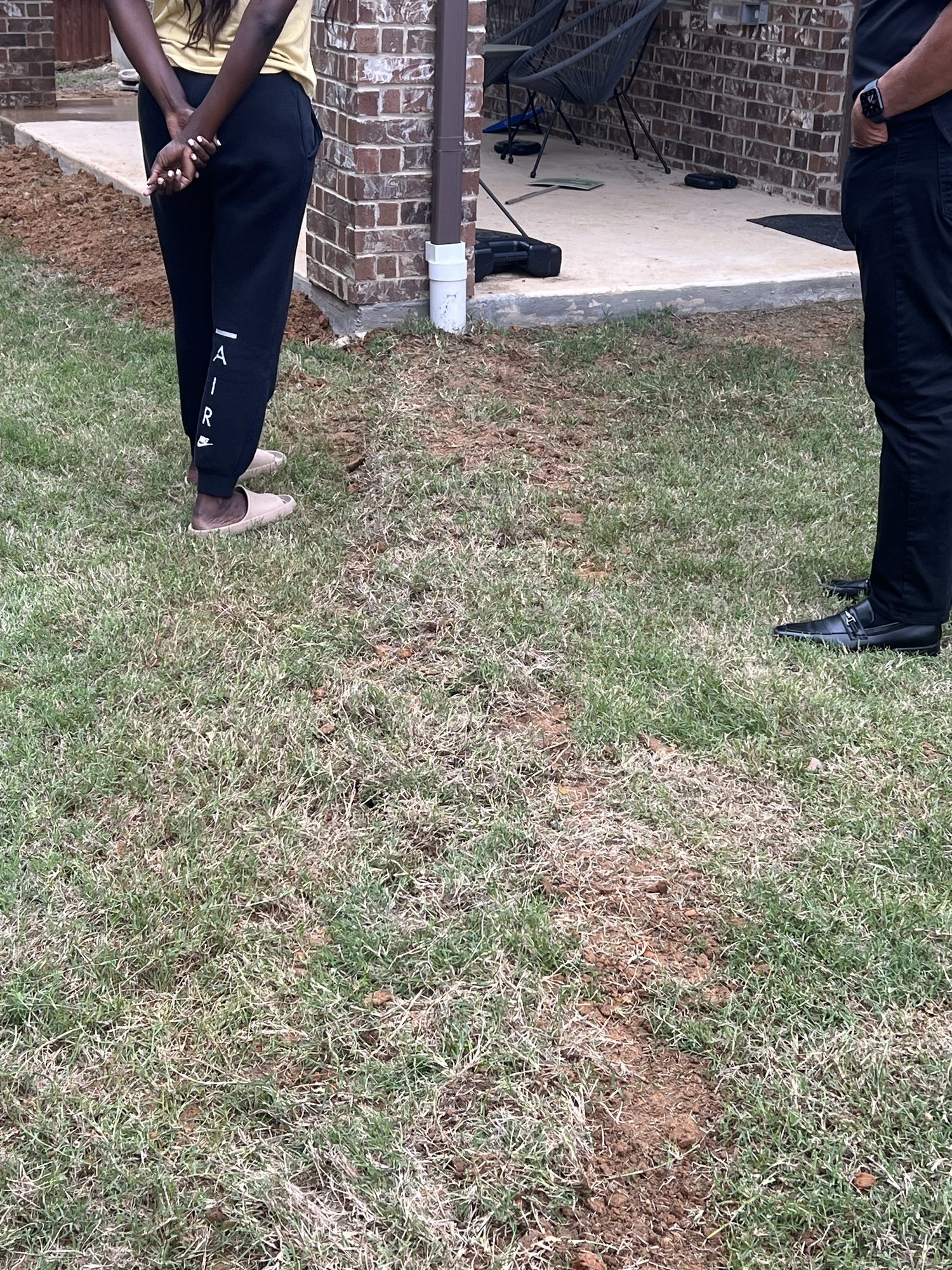 Yard downspout discharge, Imperial Foundation Repair job site in North Texas